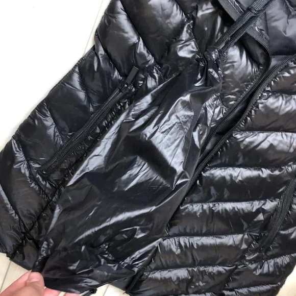Bcbgmaxazria Black, puffy jacket with hood and bag to pack it and travel with